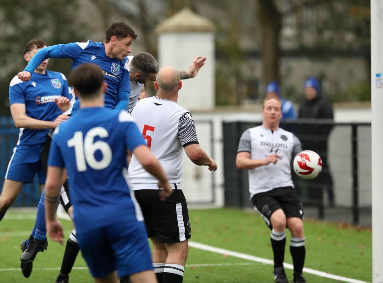 A Kilmore Rec player winning a header