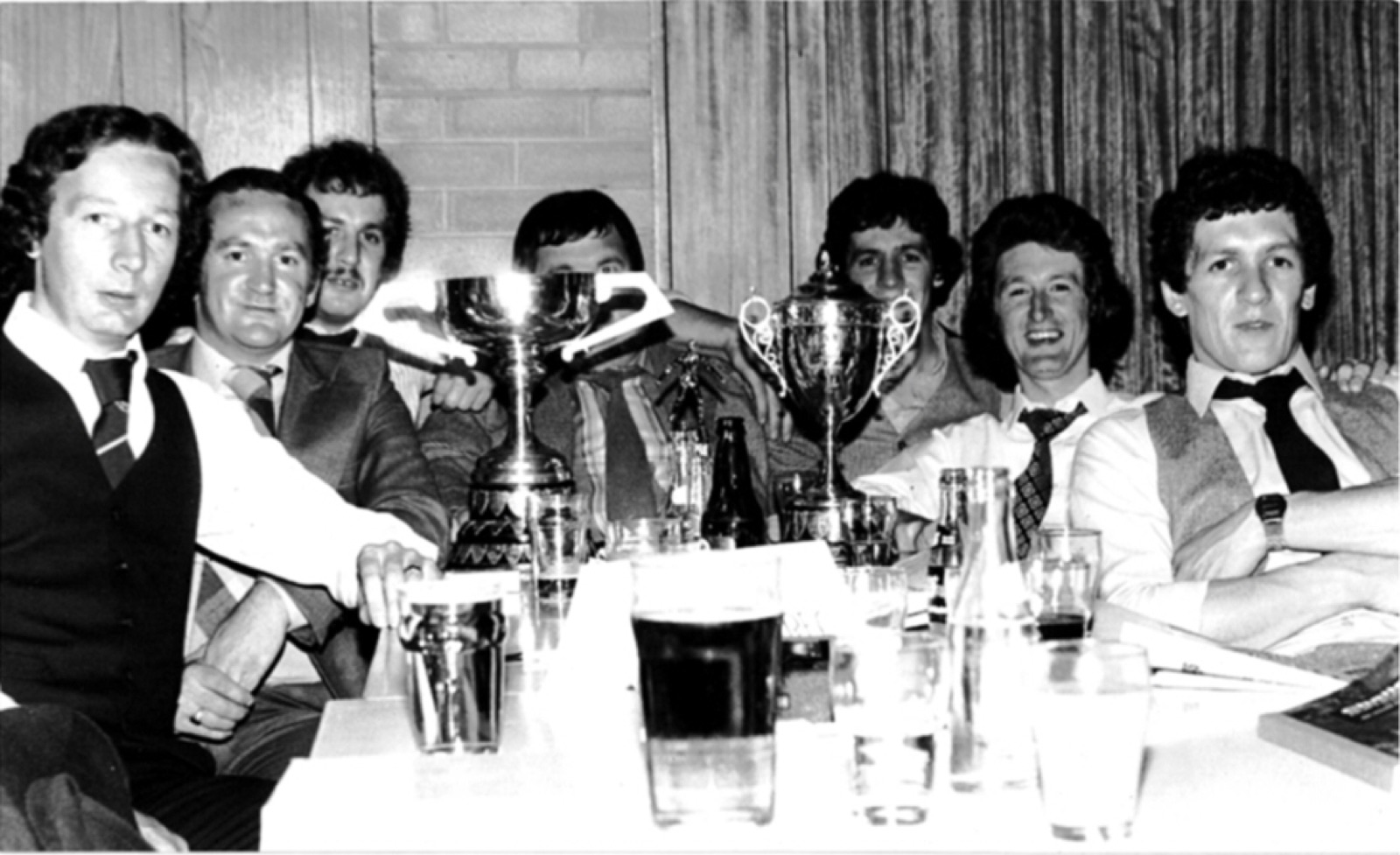 Celebrating with silverware in the title-winning era, 1980–81. From left: Paul "Ozy" Gelston, Ernie Casement, Jimmy McCarthy, Robert Adams (Mr Kilmore himself, among his players), Conleth McCarthy, Norman McClure and Noel McCarthy.