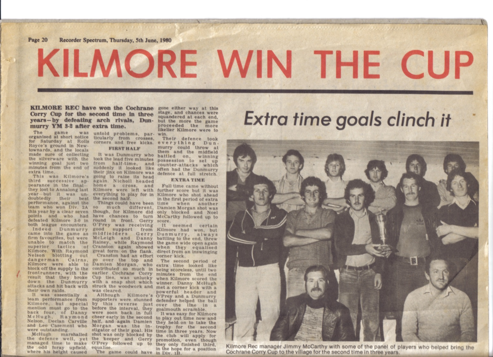 "KILMORE WIN THE CUP": the Recorder Spectrum's report of the 1980 Cochrane & Corry final: Dunmurry YM beaten 3–2 after extra time at the Rolls Royce ground, Newtownards, Danny McHugh heading the winner two minutes from the end. In the photograph, middle row: Noel McCarthy, Conleth McCarthy, manager Jimmy McCarthy, one face still unnamed, Dan McHugh. Front: Wilbert Morrow and Ernie Casement.