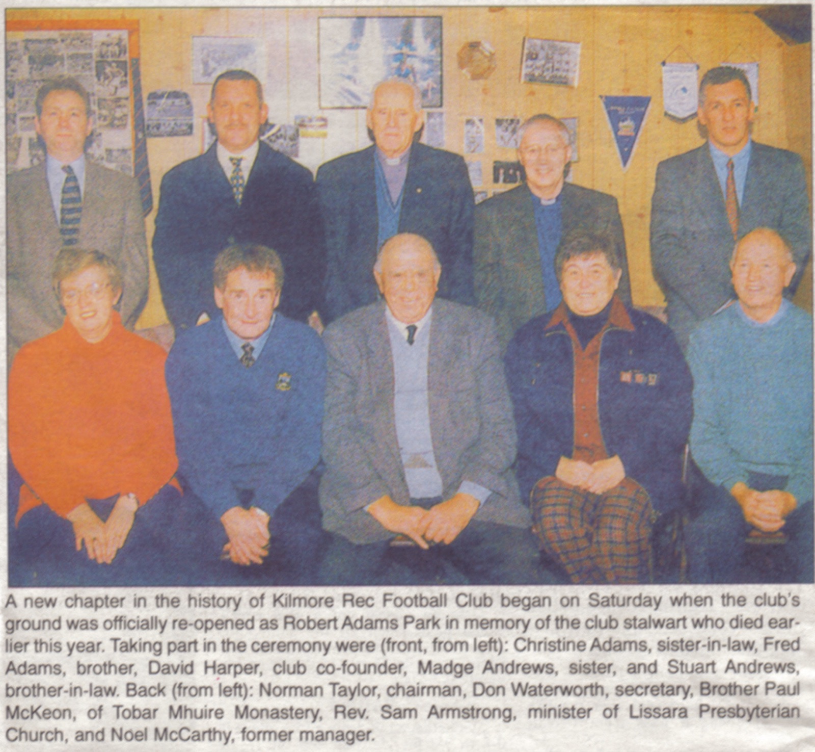 The ground officially re-opened as Robert Adams Park, 1998. Front: Christine Adams, Fred Adams, co-founder David Harper, Madge Andrews, Stuart Andrews. Back: chairman Norman Taylor, secretary Don Waterworth, Brother Paul McKeon of Tobar Mhuire, Rev. Sam Armstrong of Lissara Presbyterian, and former manager Noel McCarthy.