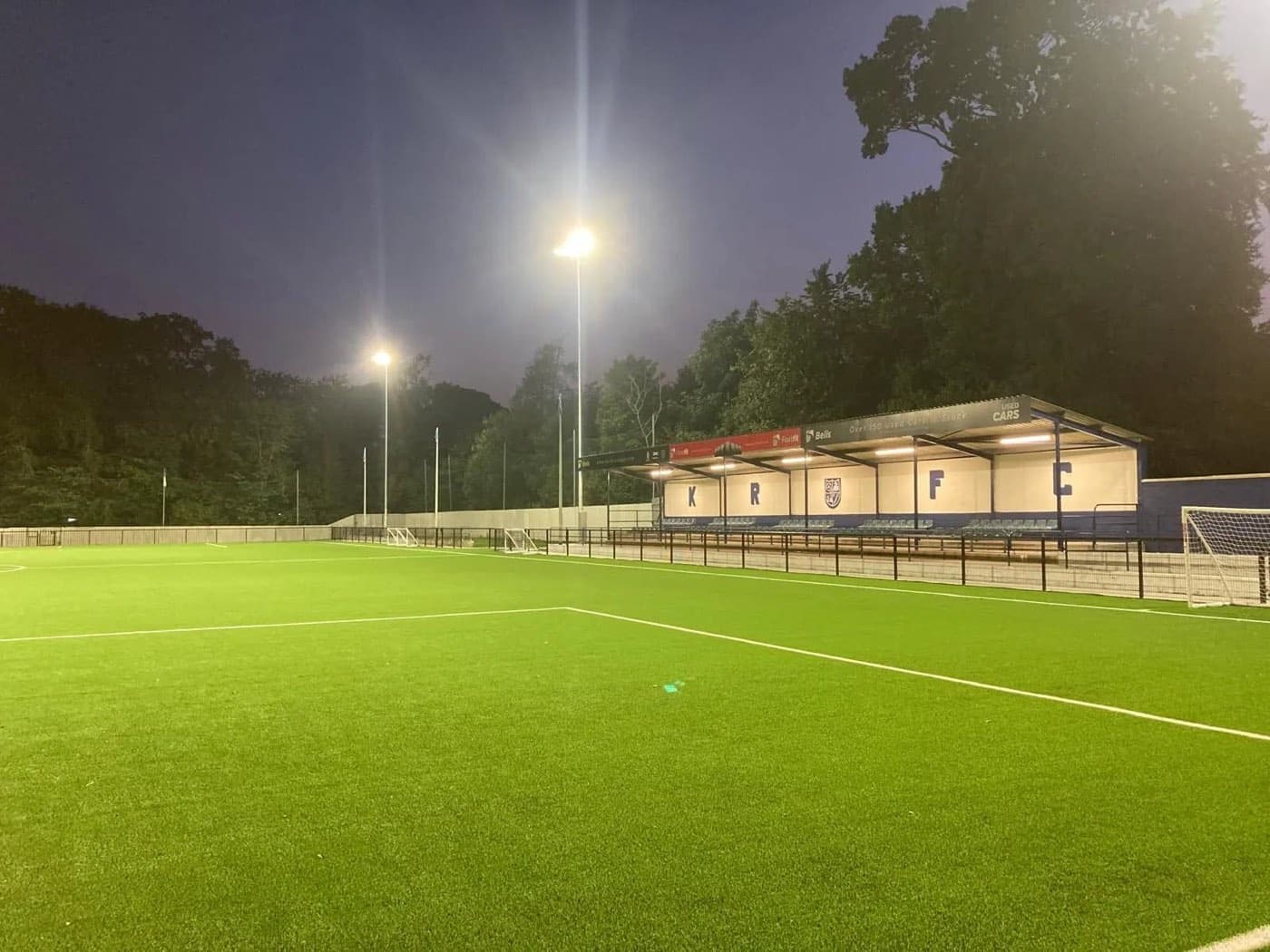 The floodlit 3G and KRFC stand at Robert Adams Park